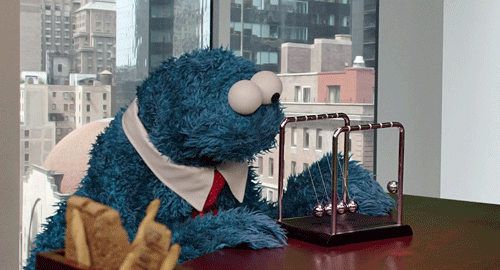 cookie monster playing with a desk game